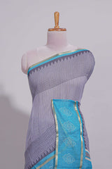 Checked linen saree with contrast blue border and pallu along with contrast printed blouse