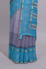 Checked linen saree with contrast blue border and pallu along with contrast printed blouse