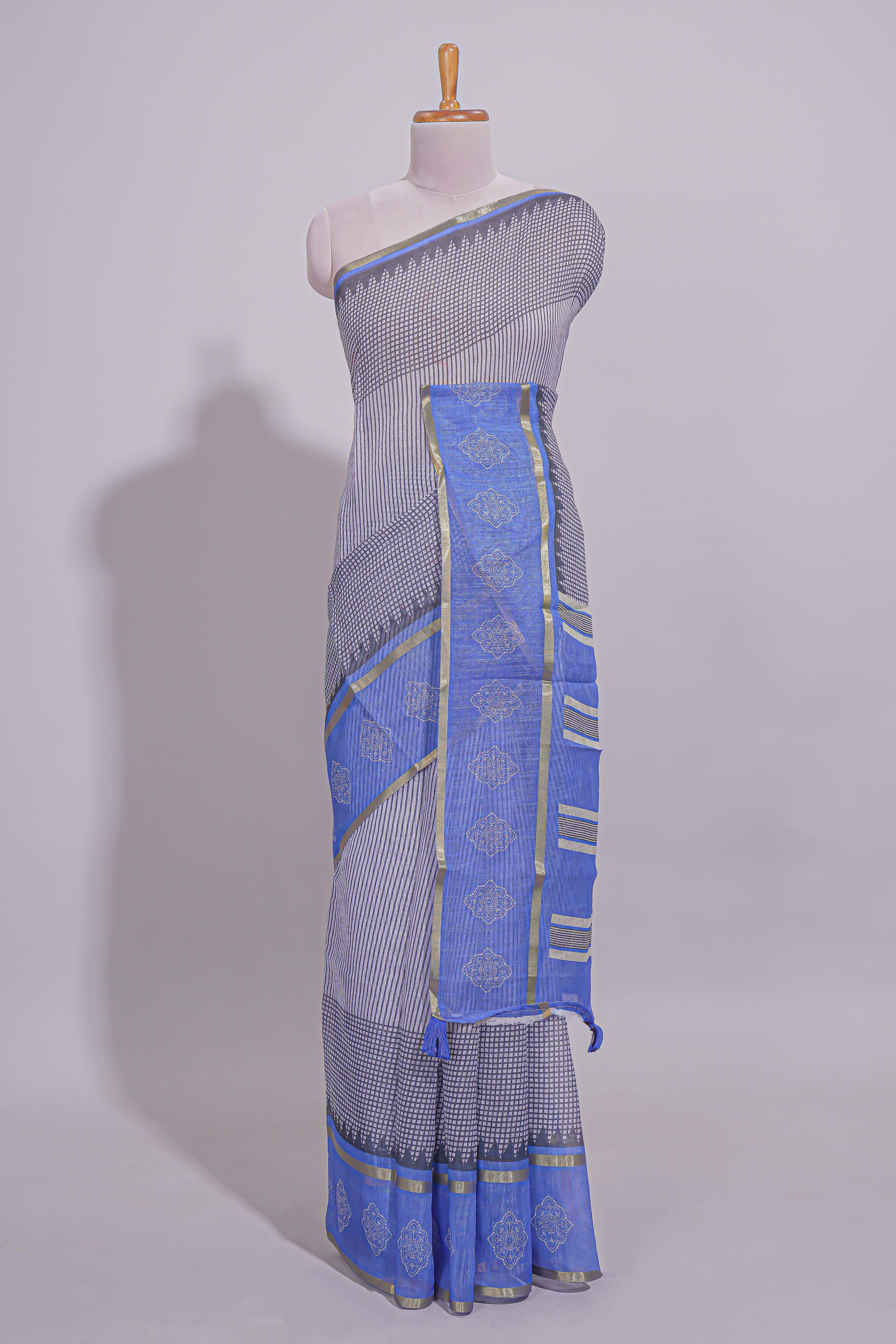 checked body linen saree with contrast border and pallu along with contrast printed blouse