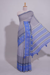 checked body linen saree with contrast border and pallu along with contrast printed blouse