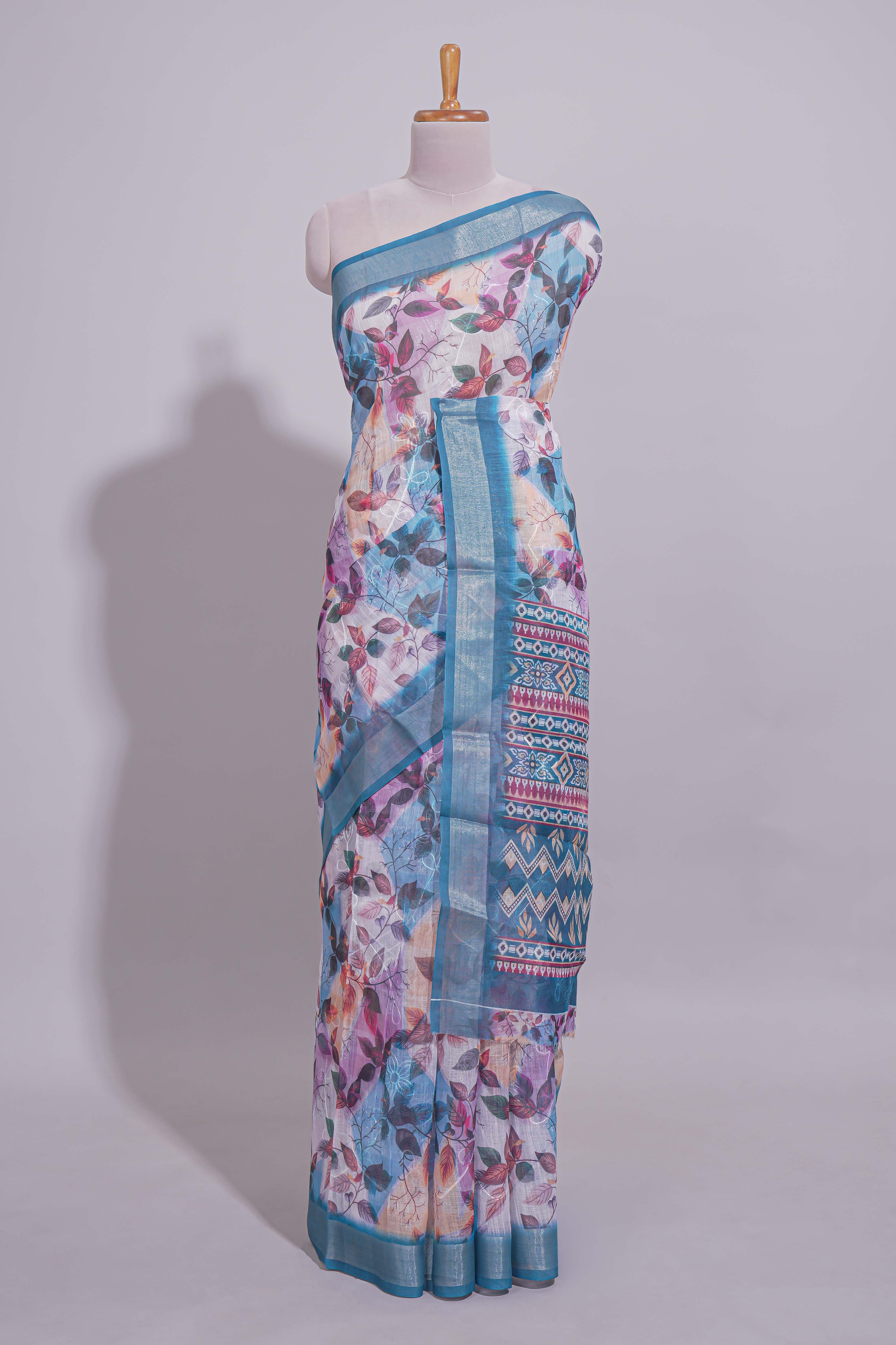 Floral printed linen cotton saree with contrast zariborder and geometric pallu along with matching blouse