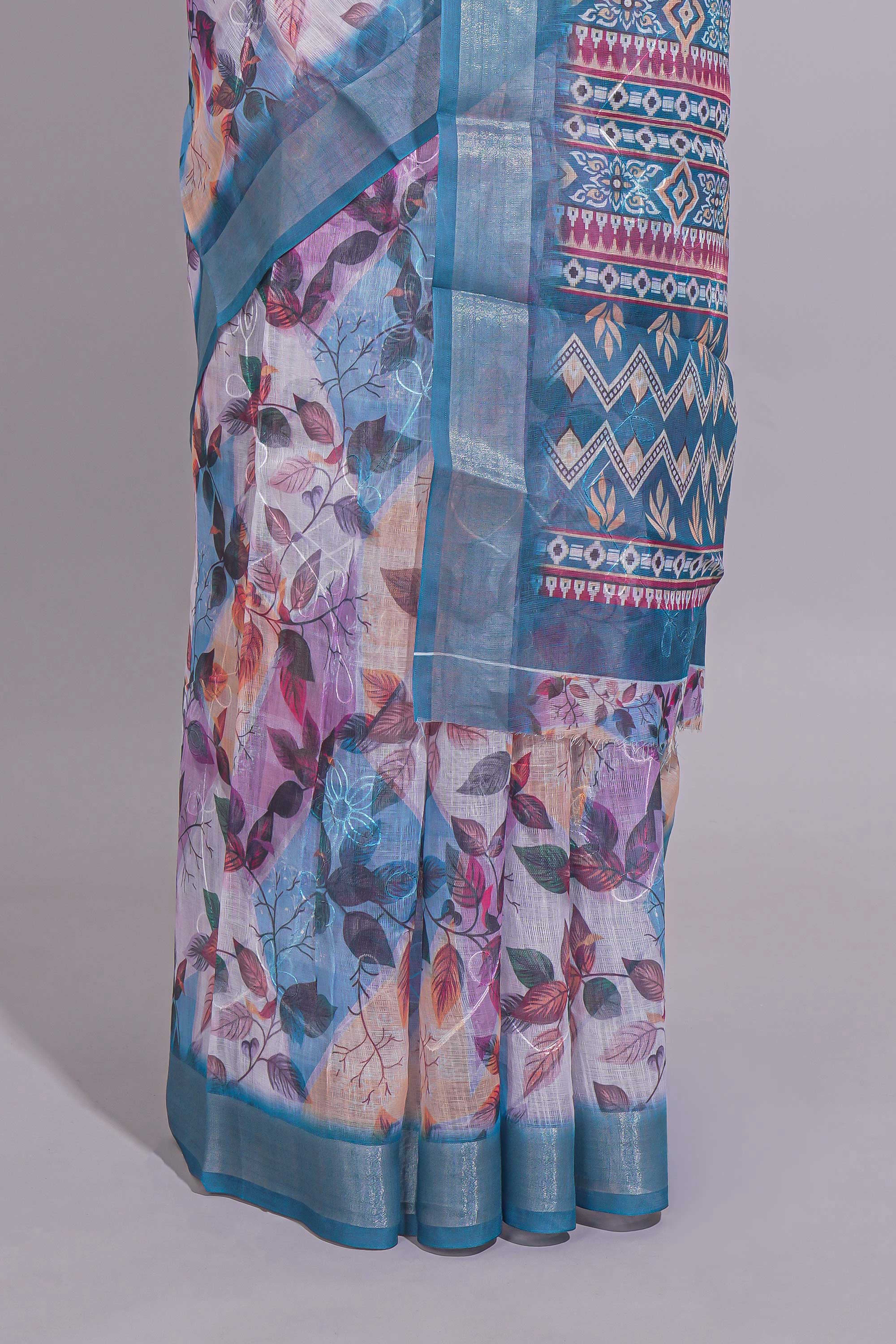 Floral printed linen cotton saree with contrast zariborder and geometric pallu along with matching blouse