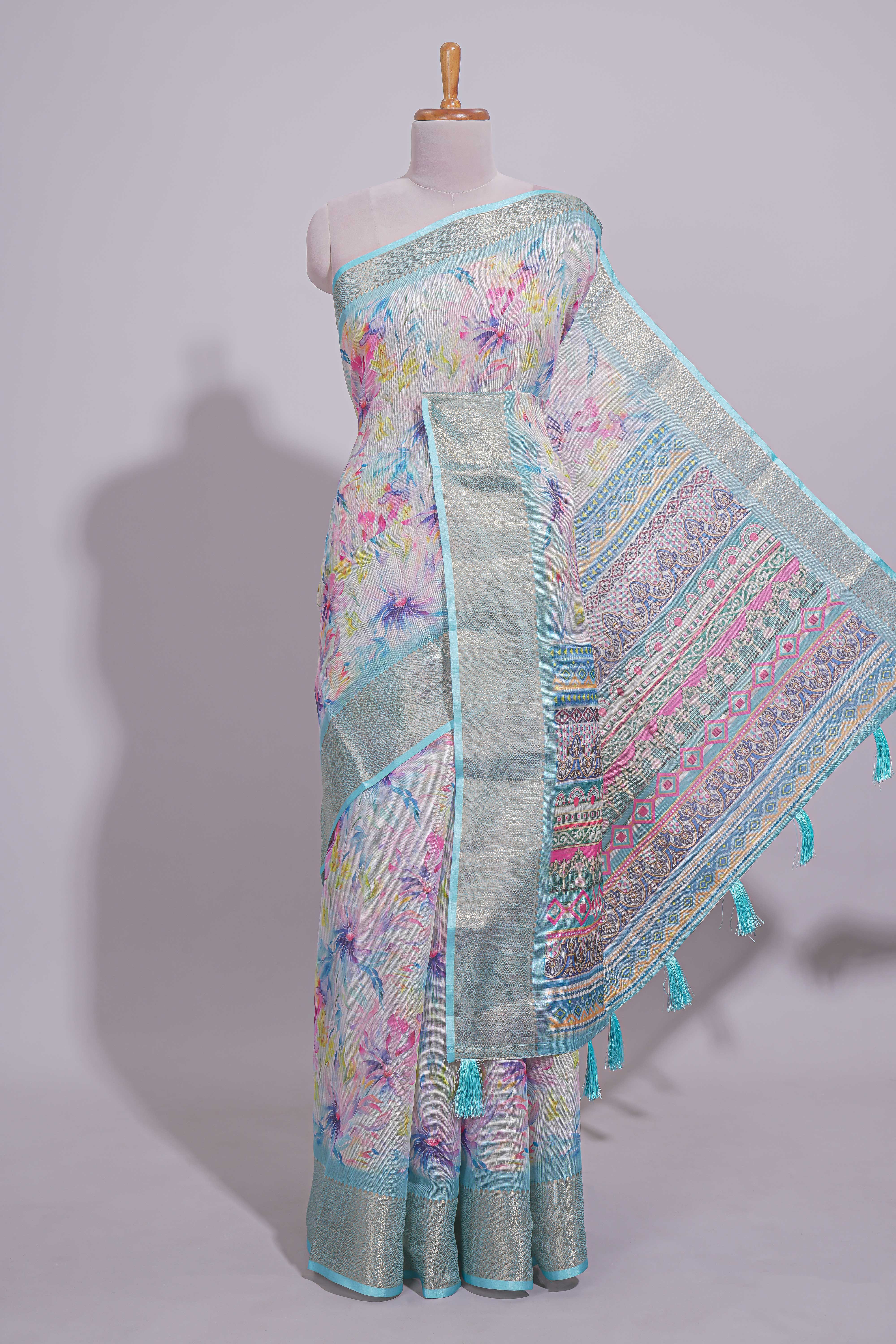 Ivory Floral linen cotton saree with contrast zariborder and self pallu along with contrast blouse