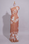 Brown linen saree with bold white floral and geometric prints finished with a subtle metallic border along with matching blouse