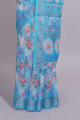 Blue Floral printed linen cotton saree with contrast zariborder and geometric pallu along with matching blouse