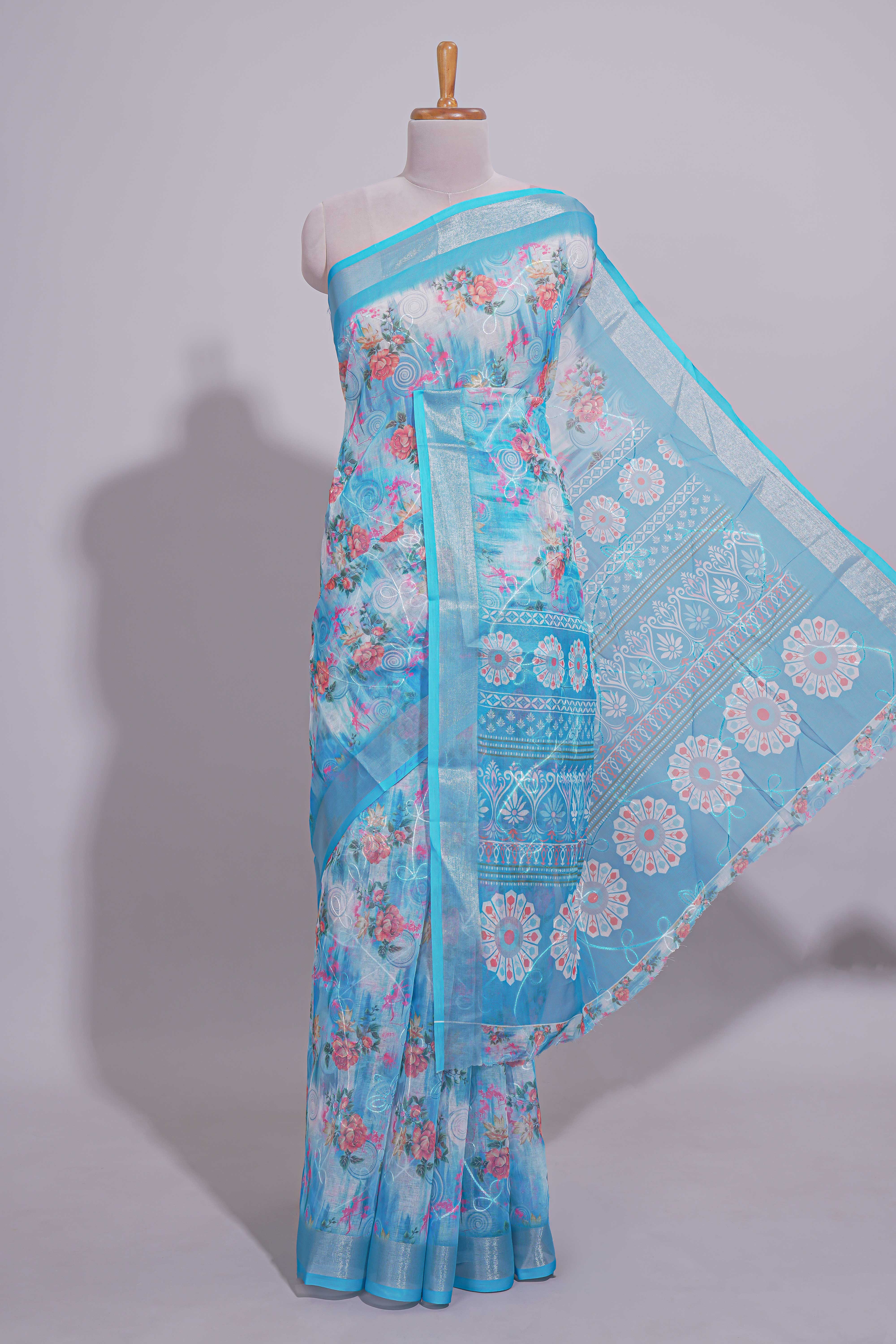 Blue Floral printed linen cotton saree with contrast zariborder and geometric pallu along with matching blouse