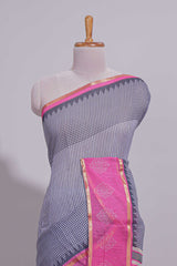 Checked linen saree with contrast border and pallu along with contrast printed blouse