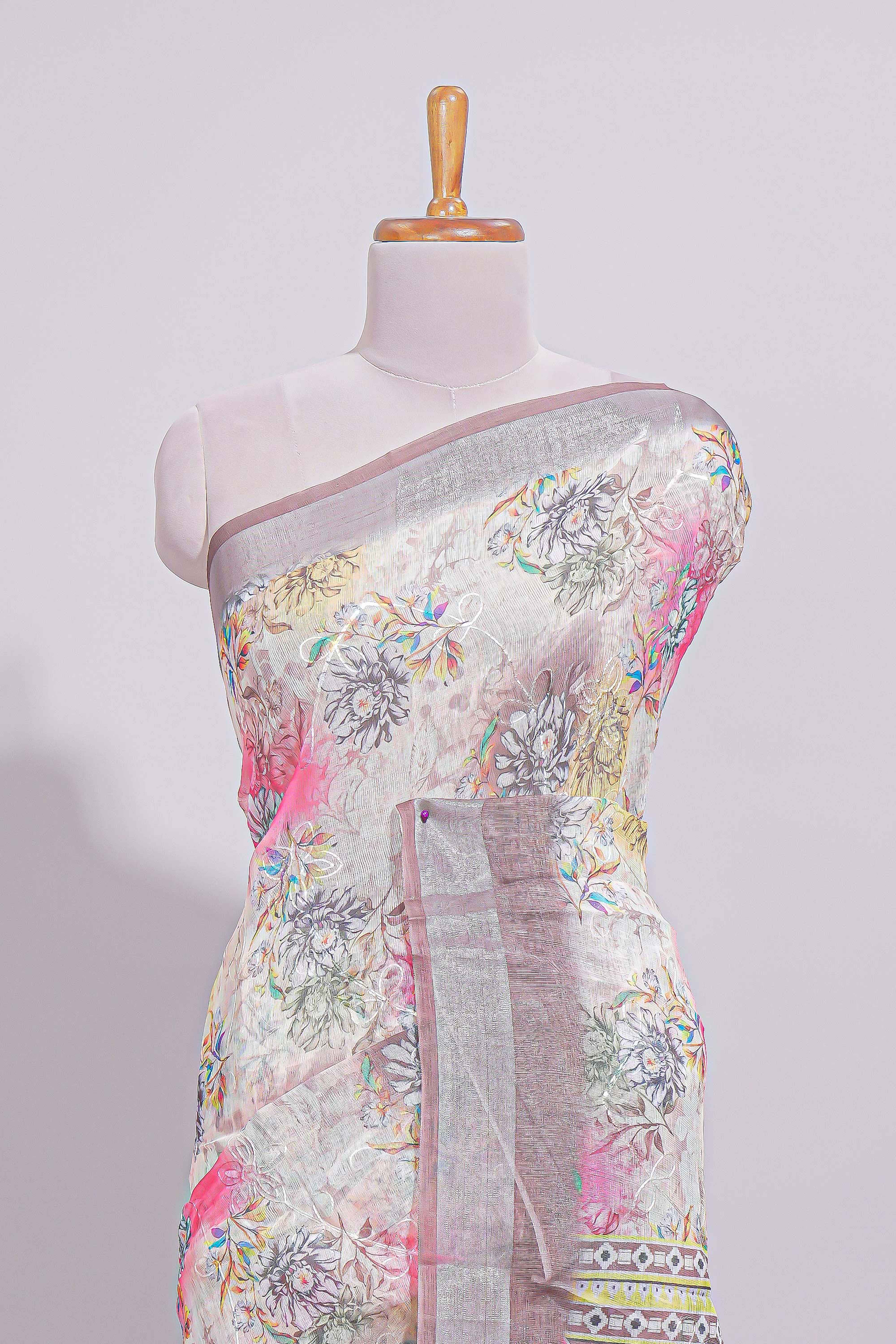 White Florallinen cotton saree with contrast zariborder and geometric pallu along with matching blouse