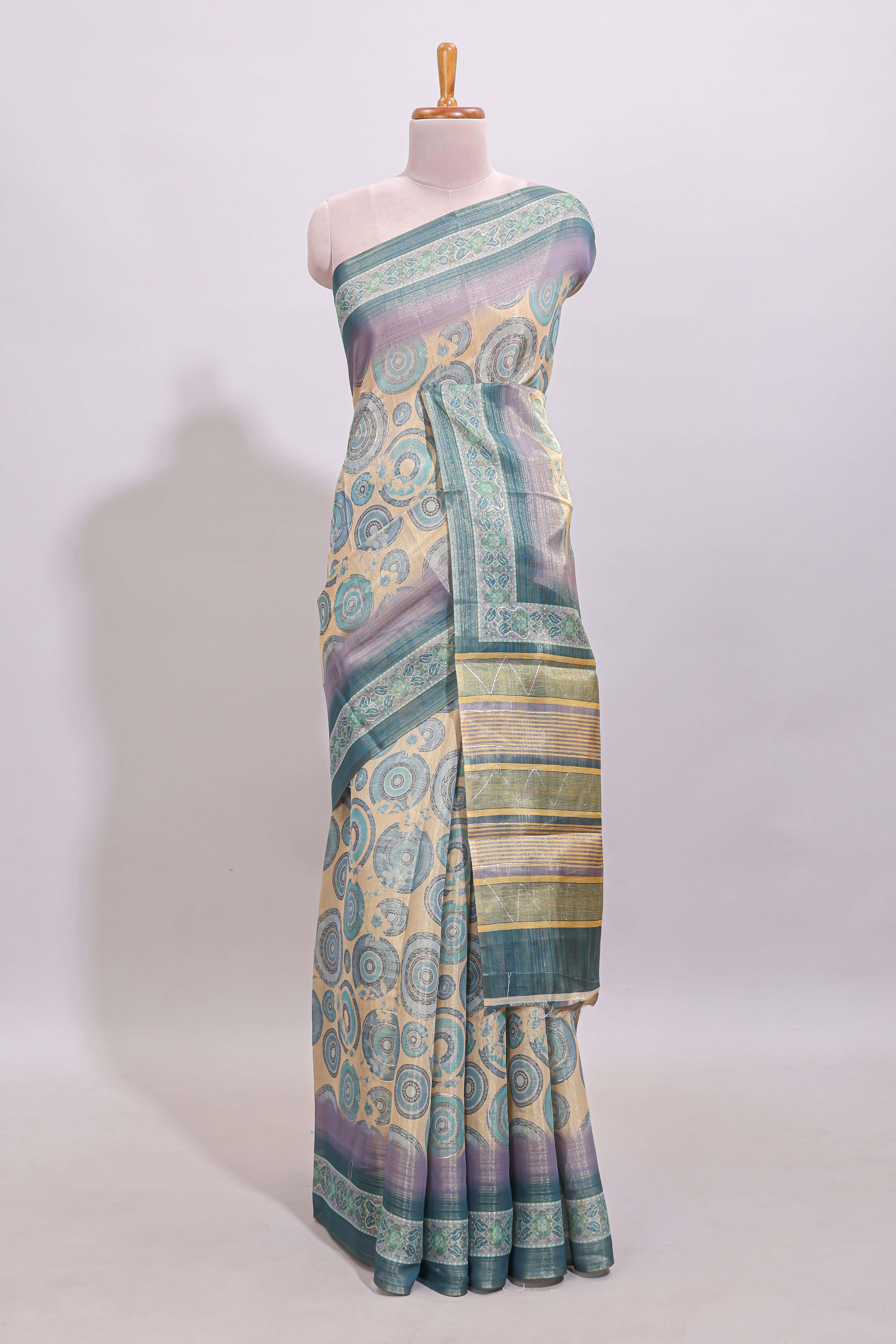 Beige colour linen cotton saree with geometric design body and contrast sea green border with geometric pallu along with matching blouse