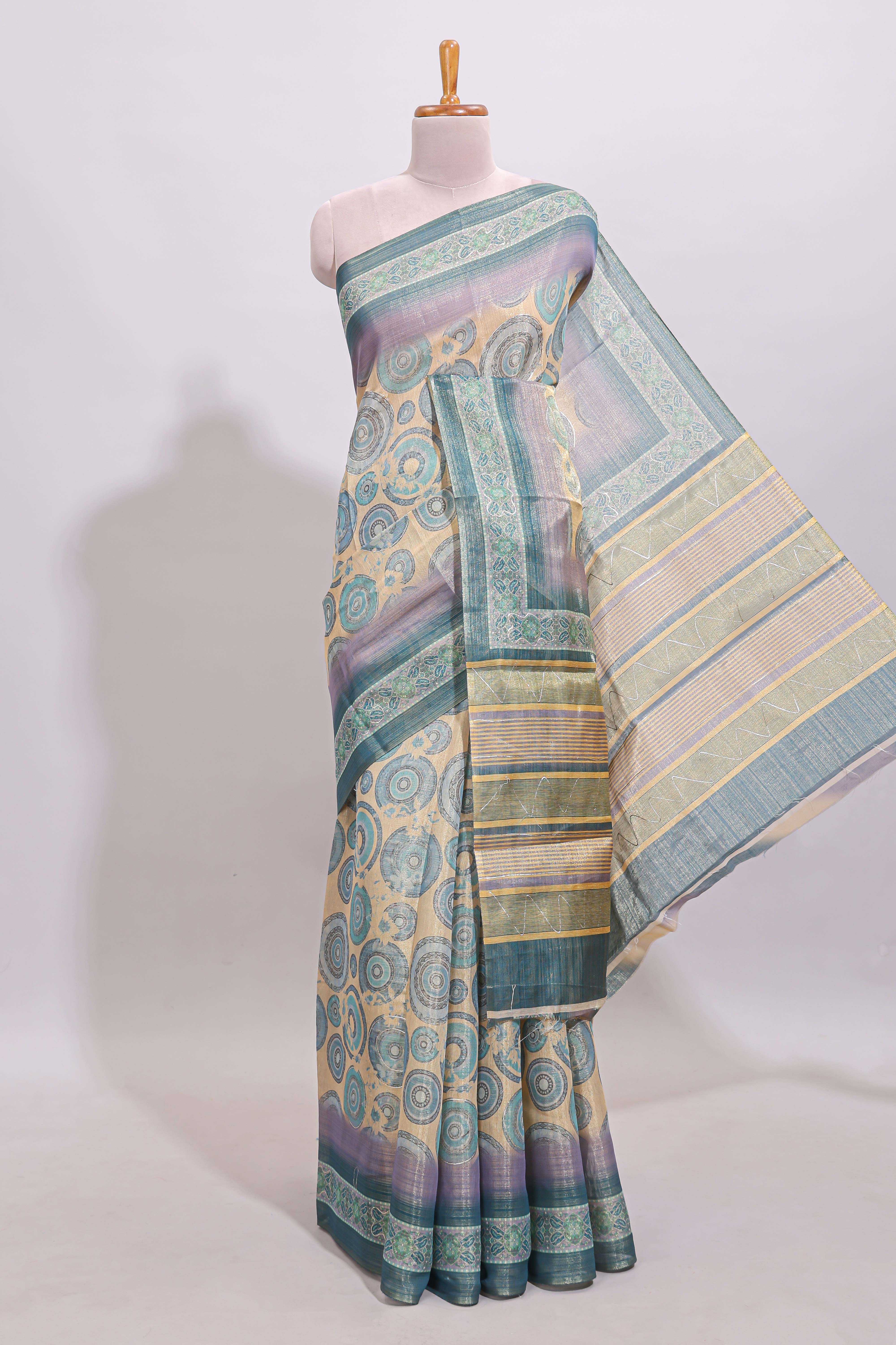 Beige colour linen cotton saree with geometric design body and contrast sea green border with geometric pallu along with matching blouse