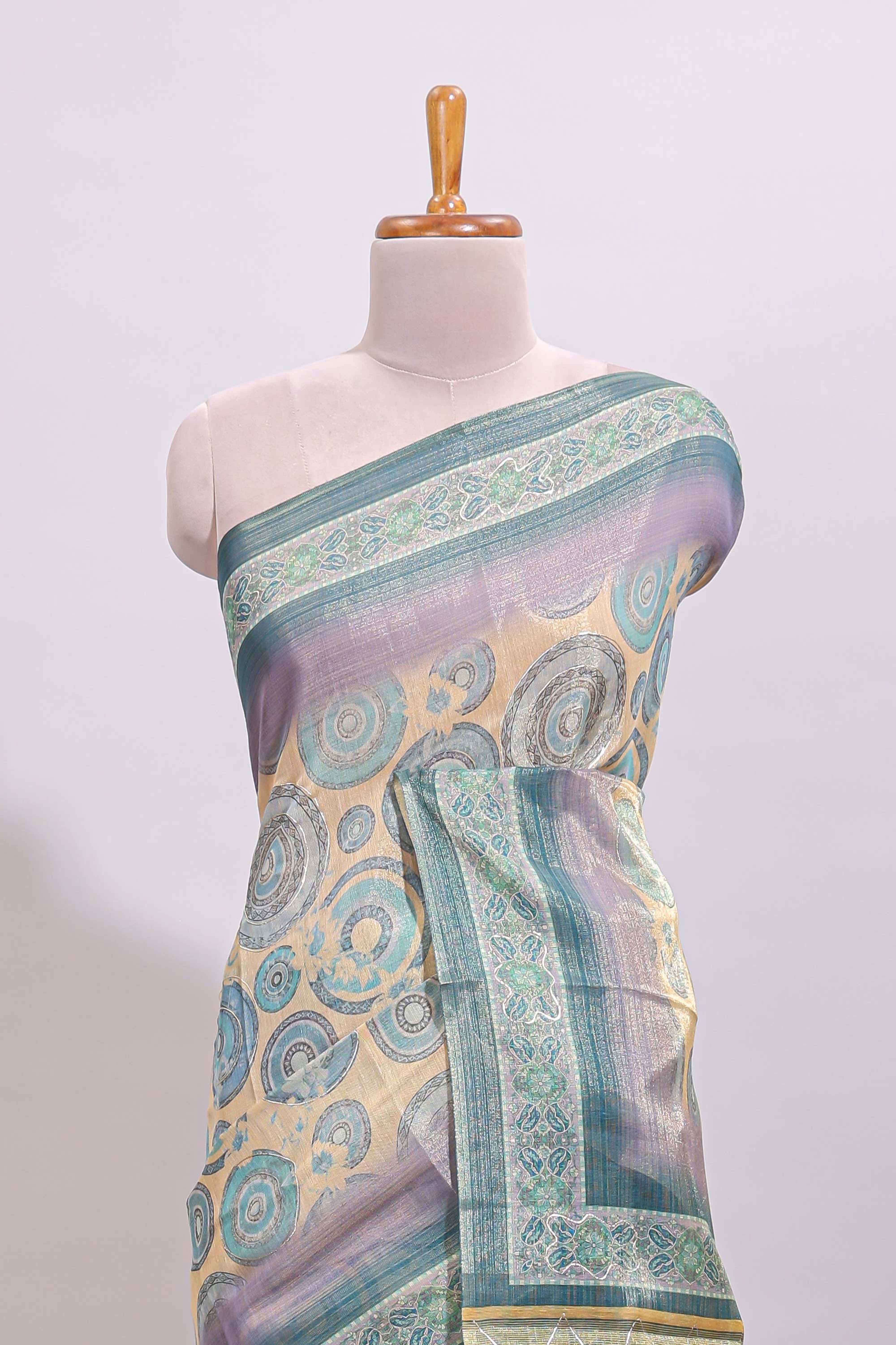 Beige colour linen cotton saree with geometric design body and contrast sea green border with geometric pallu along with matching blouse