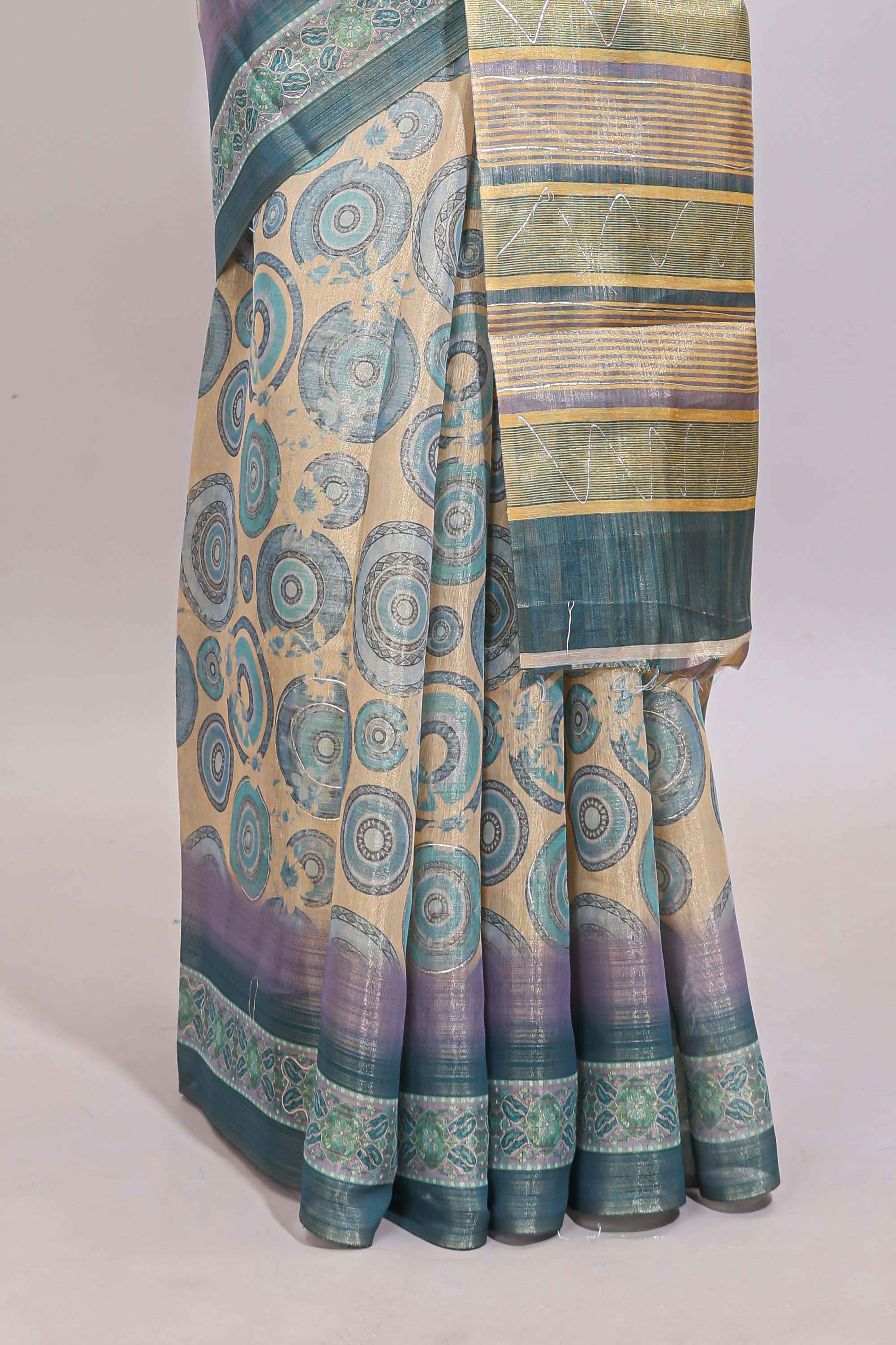 Beige colour linen cotton saree with geometric design body and contrast sea green border with geometric pallu along with matching blouse