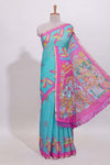 Blue stylized bird motifs linen cotton saree with contrast border and blouse