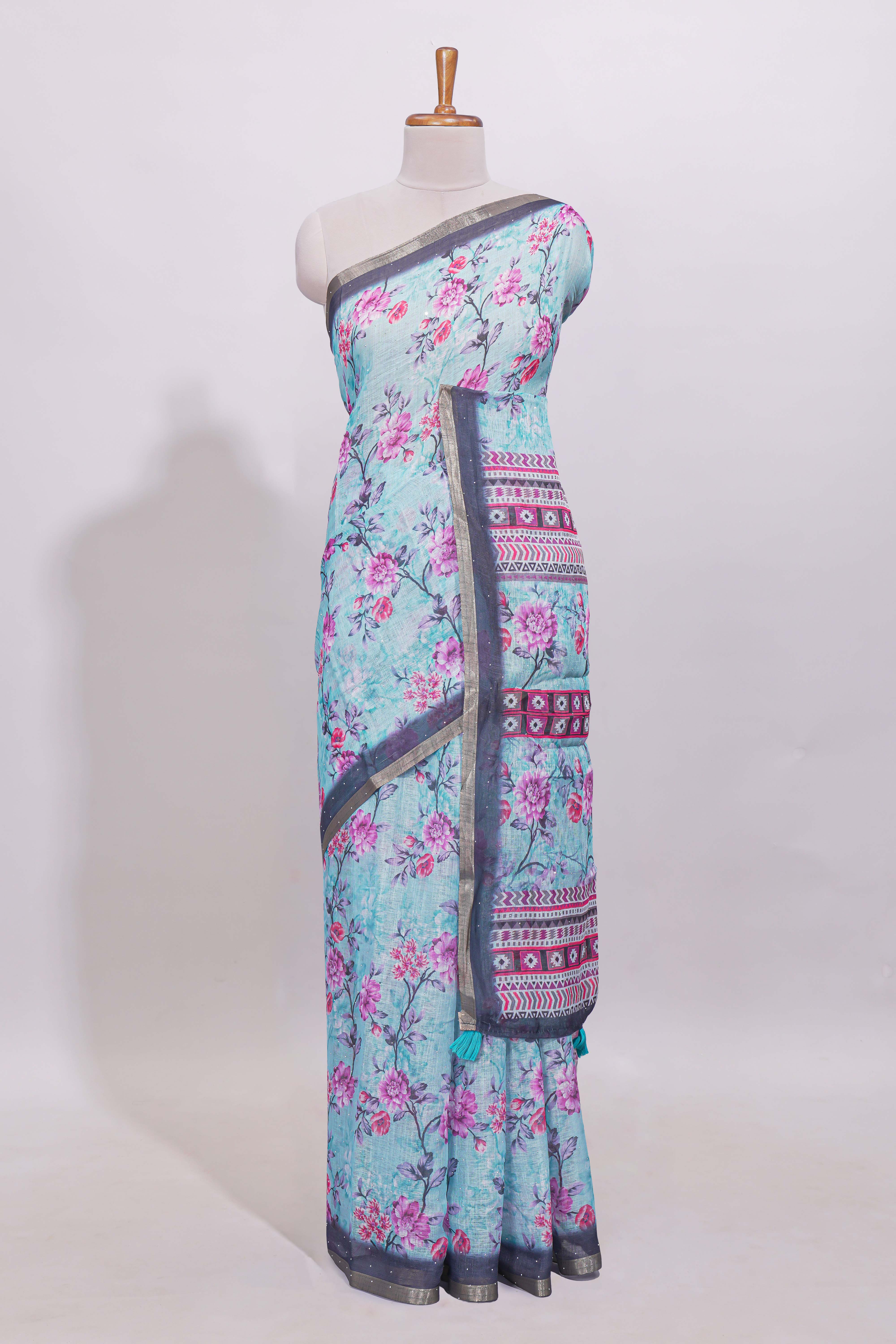 Blue floral designed linen cotton saree with contrast border and matching blouse