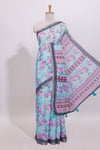 Blue floral designed linen cotton saree with contrast border and matching blouse
