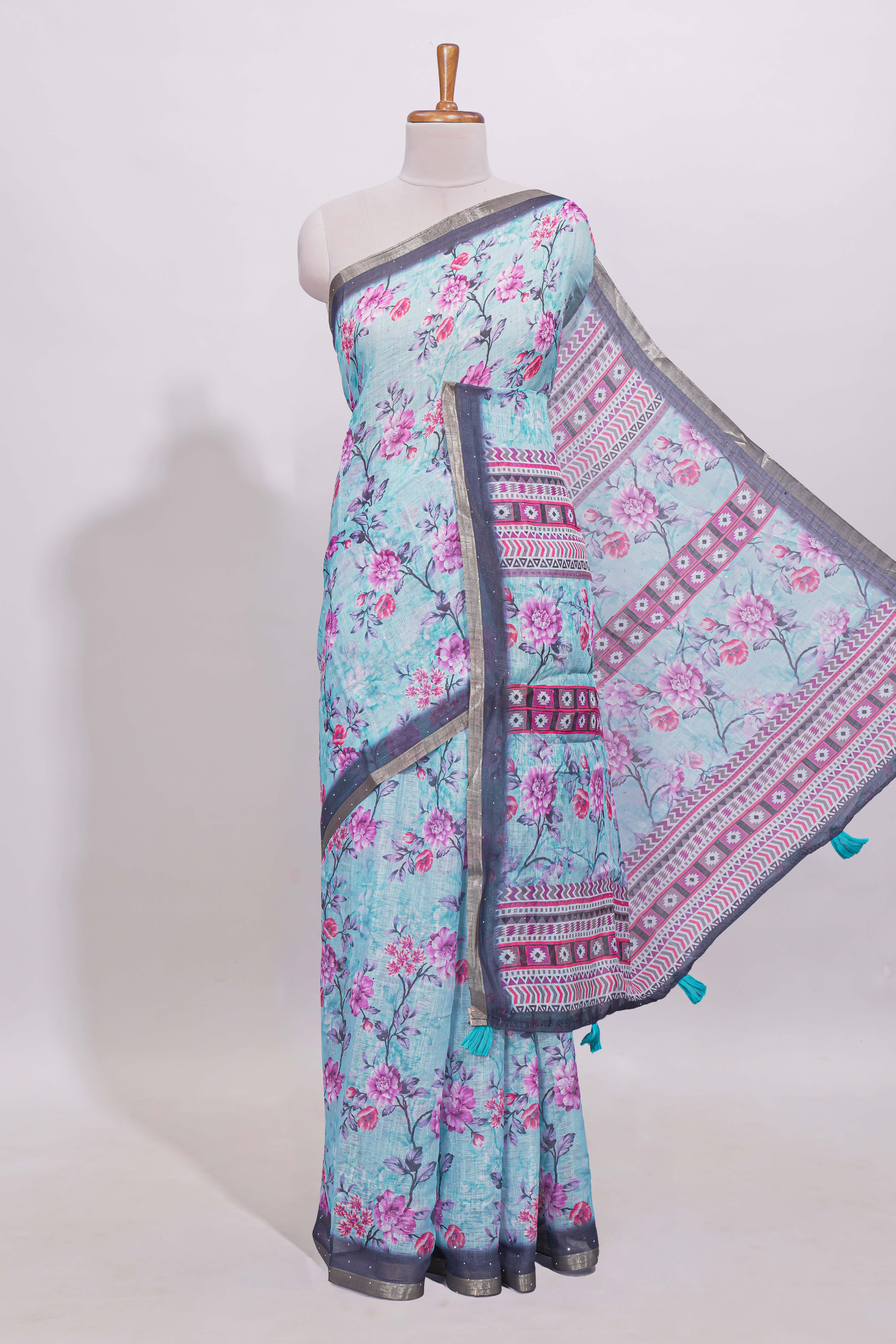 Blue floral designed linen cotton saree with contrast border and matching blouse