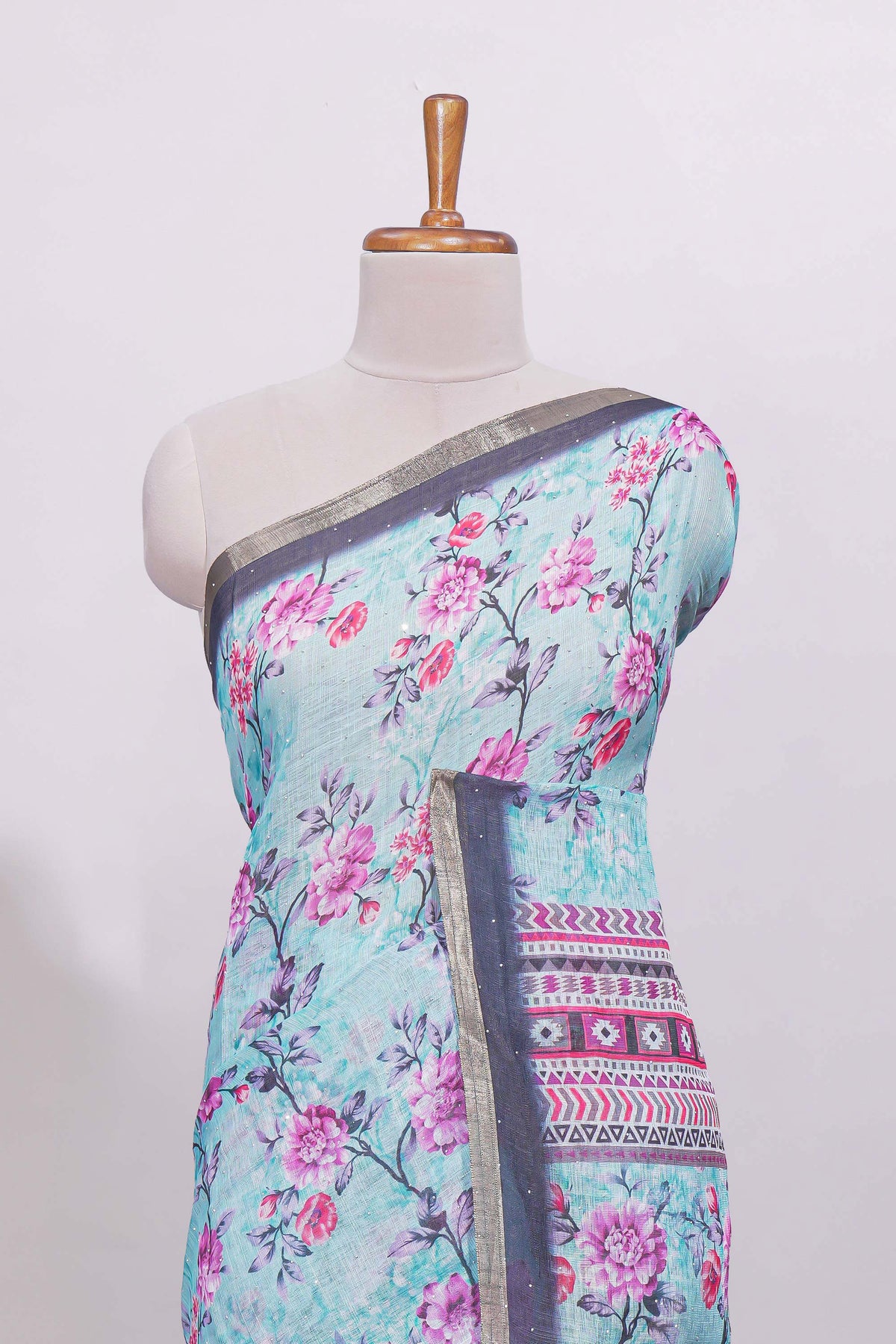 Blue floral designed linen cotton saree with contrast border and matching blouse