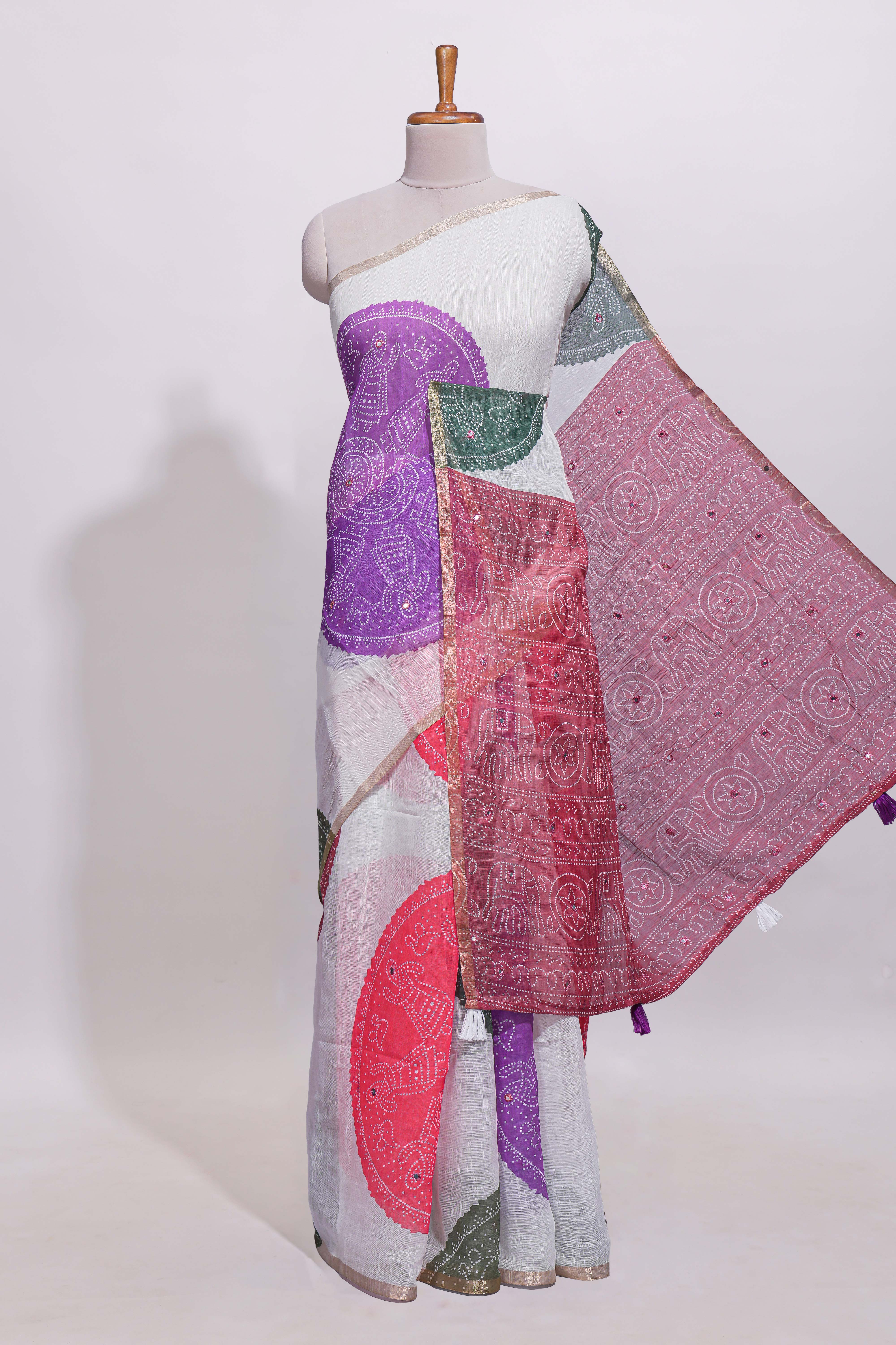 White bandhini designed linen cotton saree with self border and contrast blouse