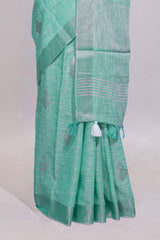 Mint green butta designed linen cotton saree with self zari border and matching blouse