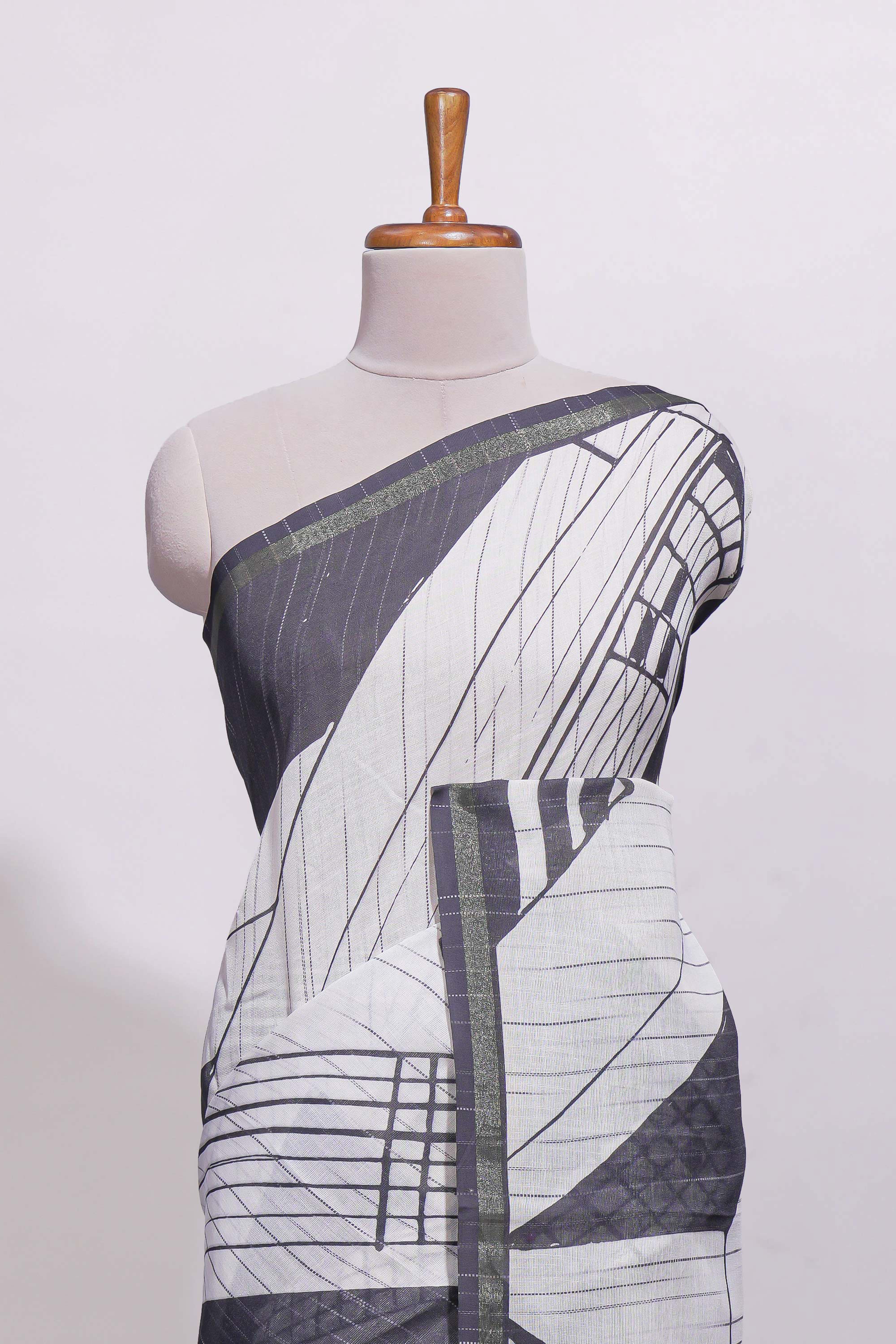 White geometric designed linen cotton saree with contrast border and blouse