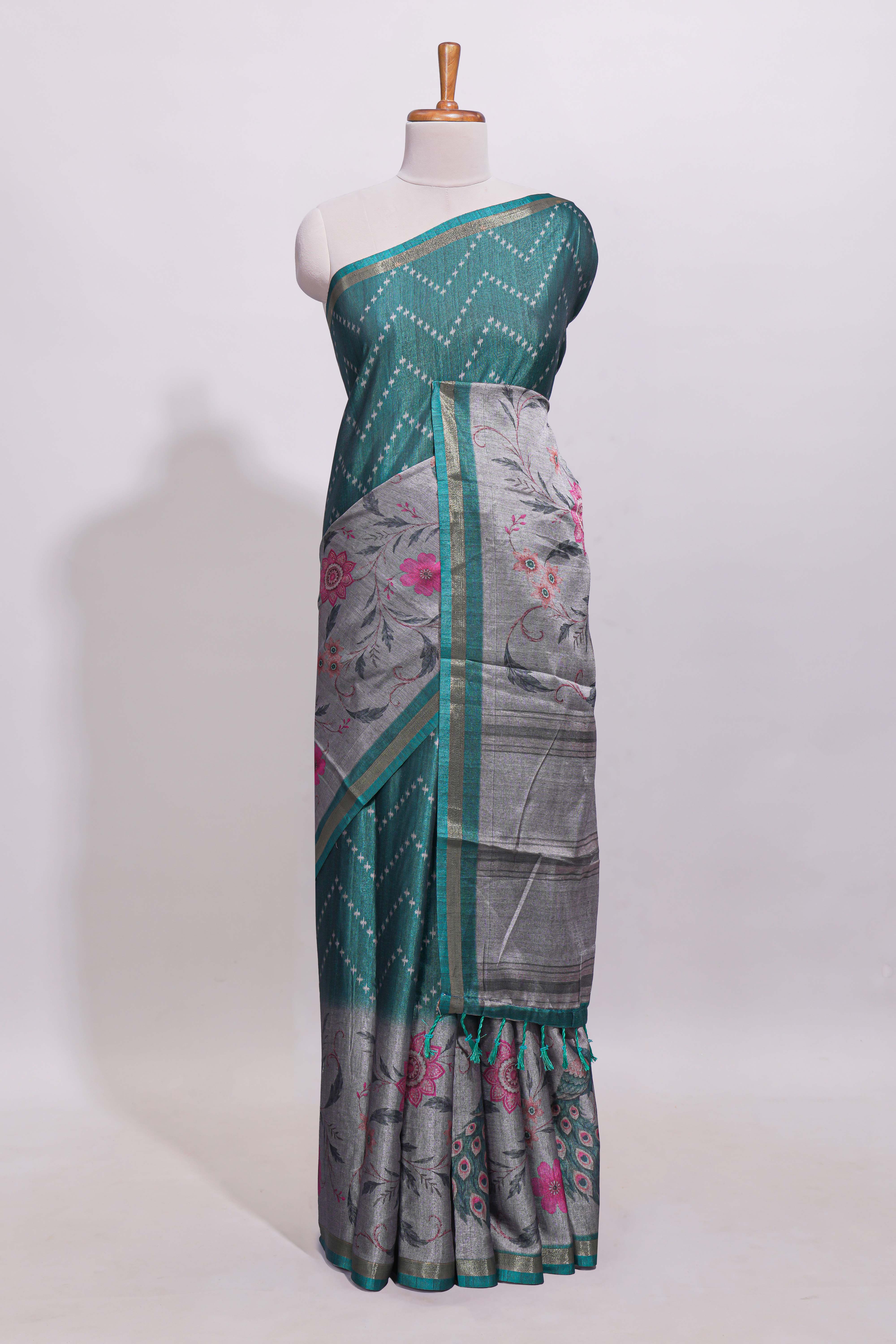 Teal green geometric designed linen cotton saree with contrast border and blouse