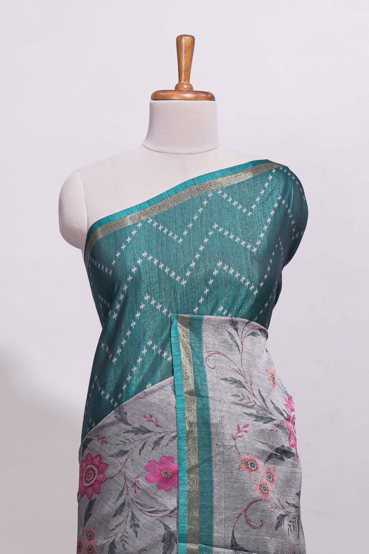 Teal green geometric designed linen cotton saree with contrast border and blouse