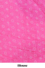 White bandhini designed linen cotton saree with self border and contrast pink blouse