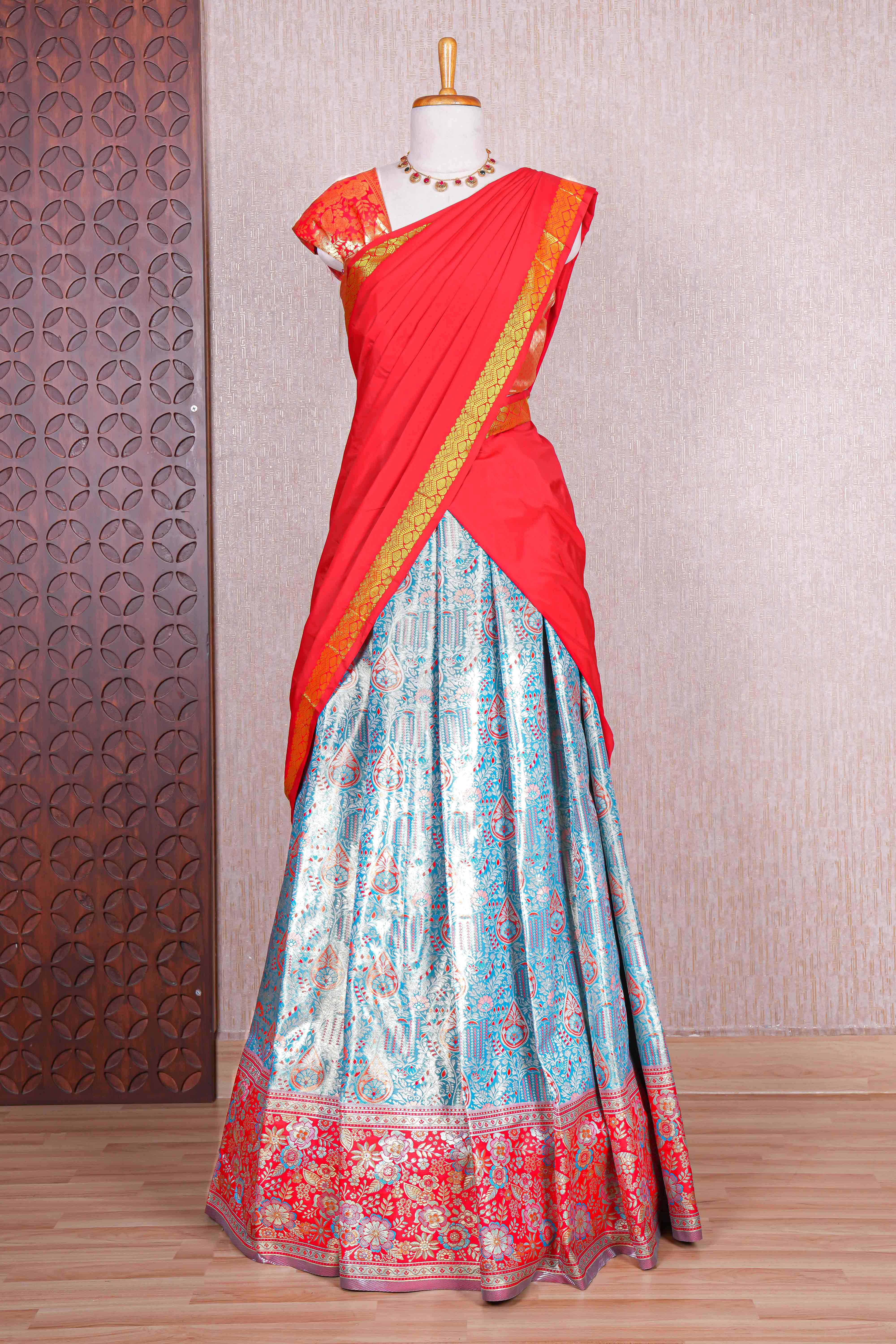 Sky blue jacquard floral zari design half saree with contrast zari border and dhavani