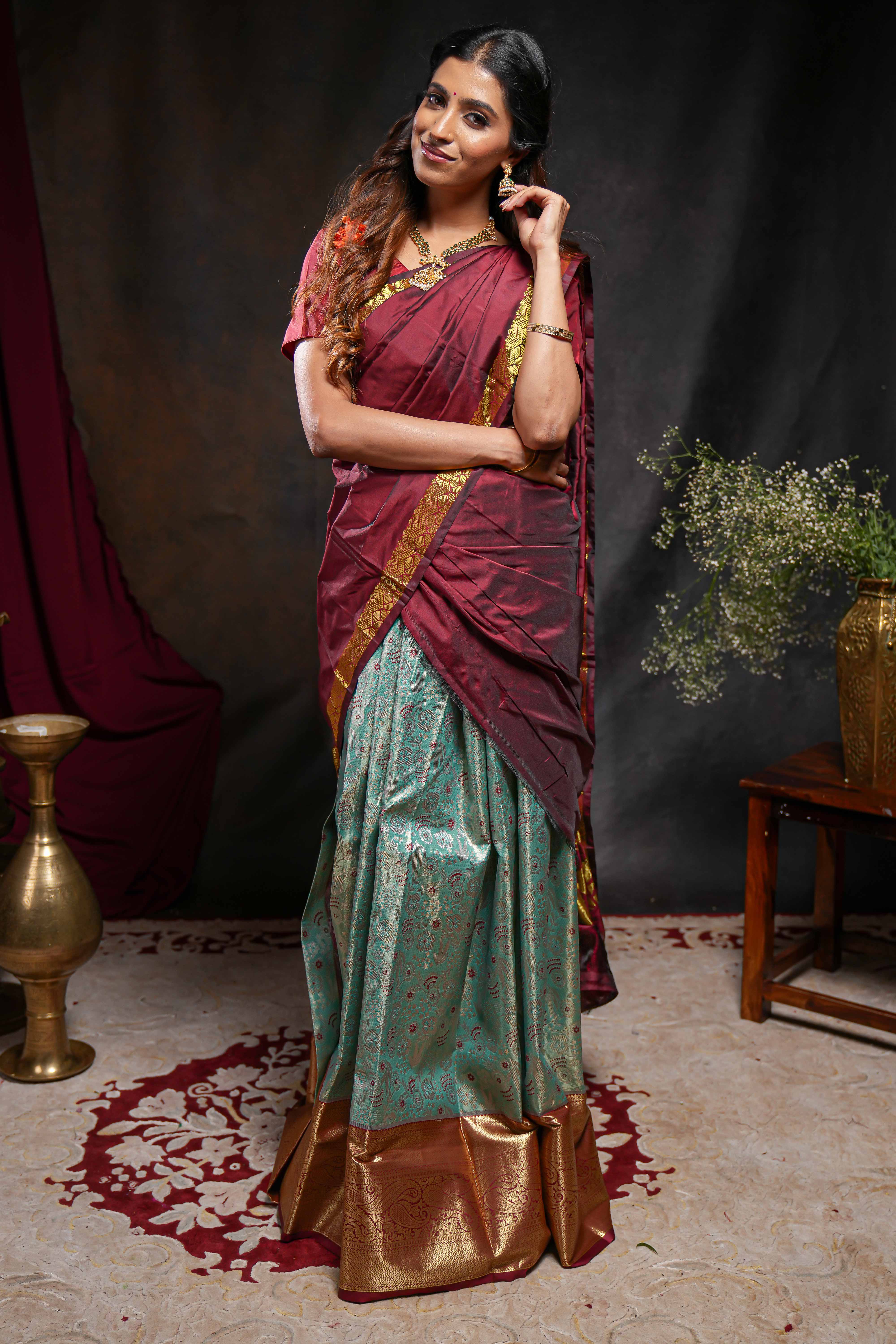 Turquoise green jacquard floral zari design half saree with contrast zari border and dhavani