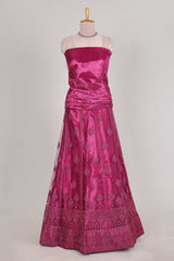 Rose colour net lehenga featuring delicate embroidery with a borderless design paired with a matching self shawl