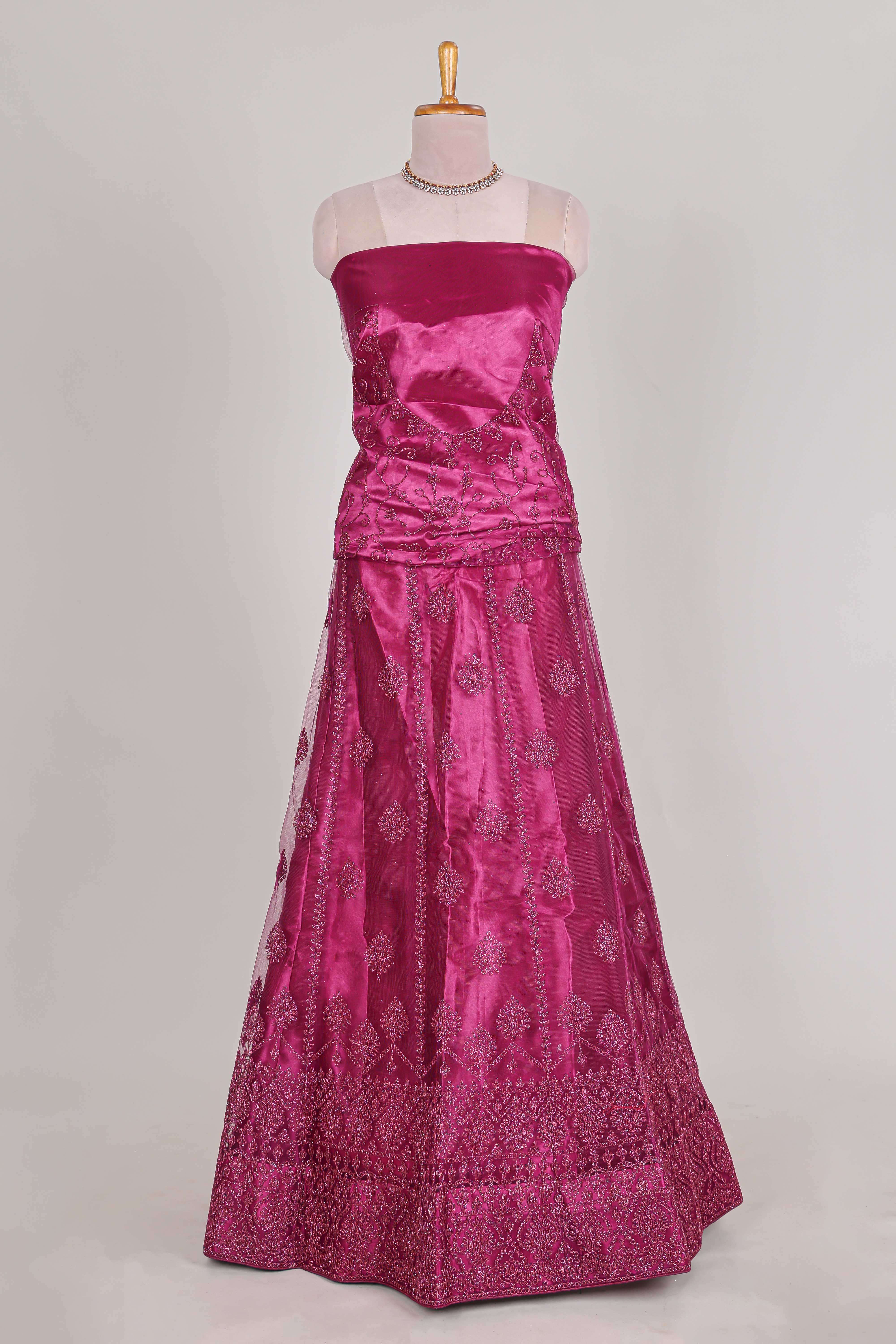 Rose colour net lehenga featuring delicate embroidery with a borderless design paired with a matching self shawl