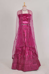Rose colour net lehenga featuring delicate embroidery with a borderless design paired with a matching self shawl