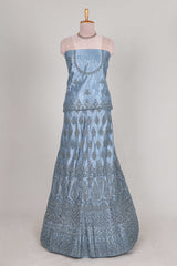 Sea blue colour net lehenga featuring delicate embroidery stone work with a borderless design paired with a matching self shawl