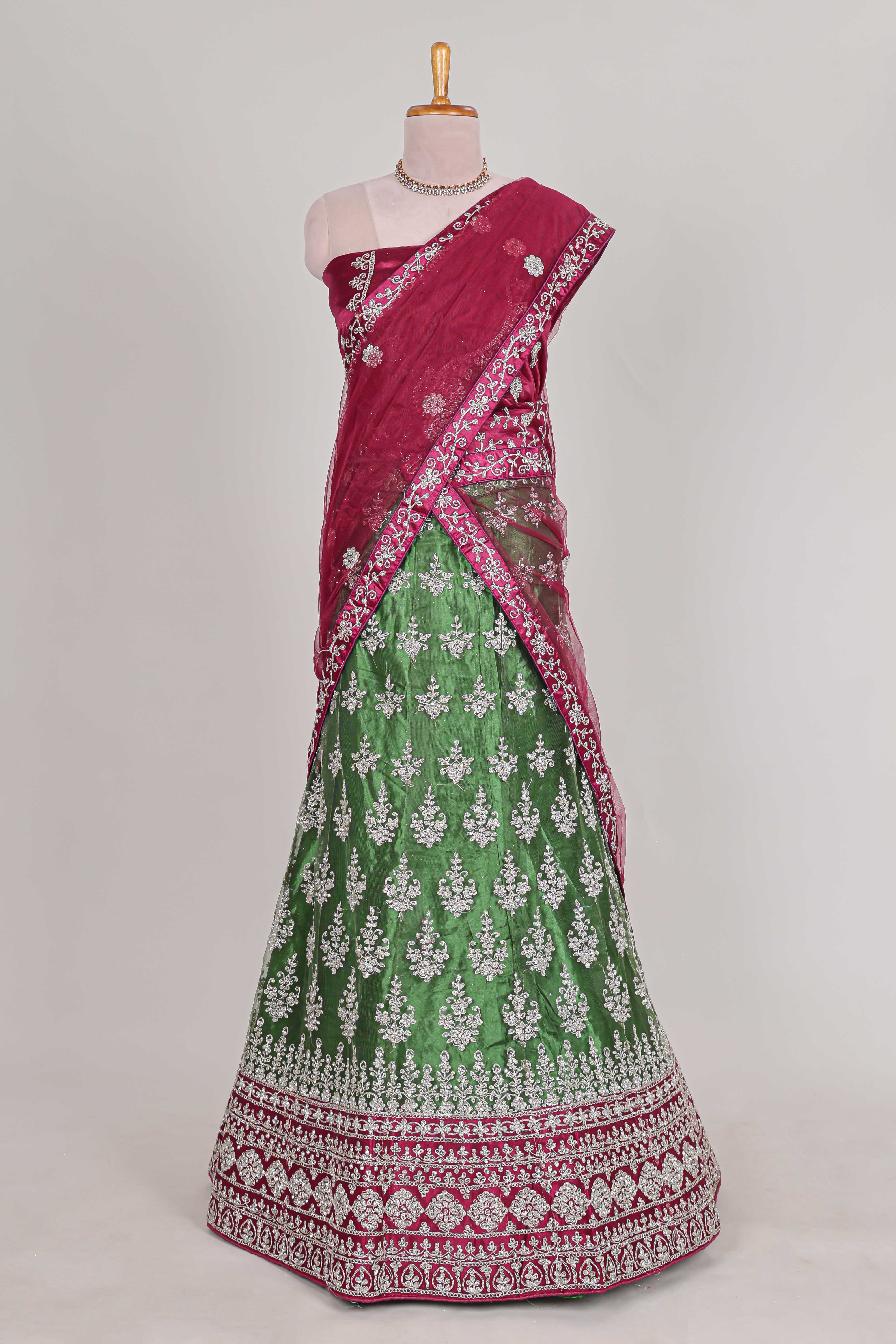 Beautiful net lehenga with intricate embroidery stone work and contrast border paired with a contrast net shawl