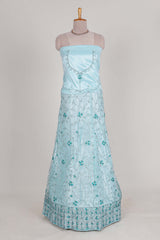 powder blue net lehenga featuring delicate embroidery with a borderless design paired with a matching self shawl
