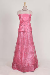 Pink net lehenga featuring delicate embroidery with a borderless design paired with a matching self shawl