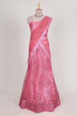 Pink net lehenga featuring delicate embroidery with a borderless design paired with a matching self shawl