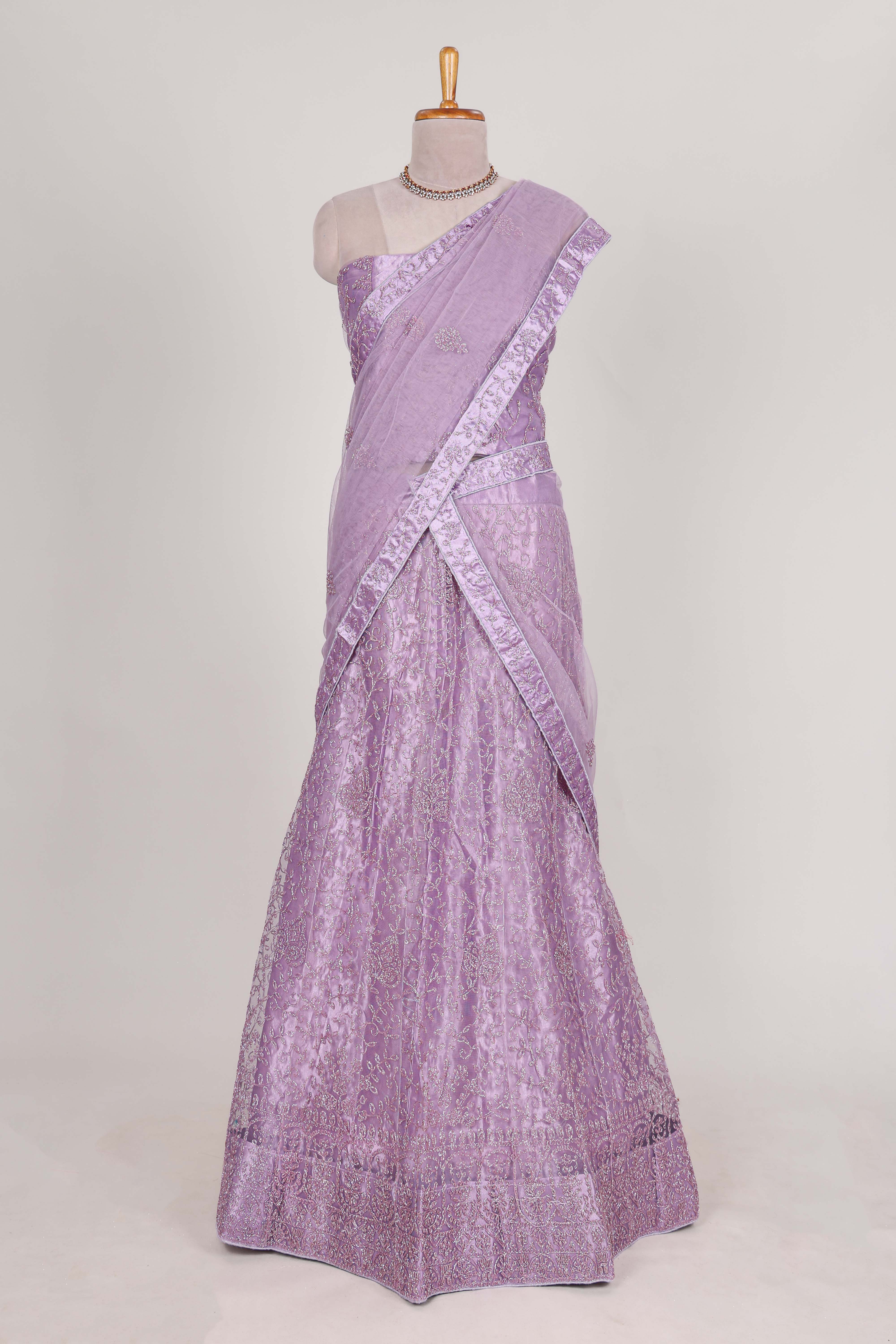 Lavender net lehenga featuring delicate embroidery with a borderless design paired with a matching self shawl