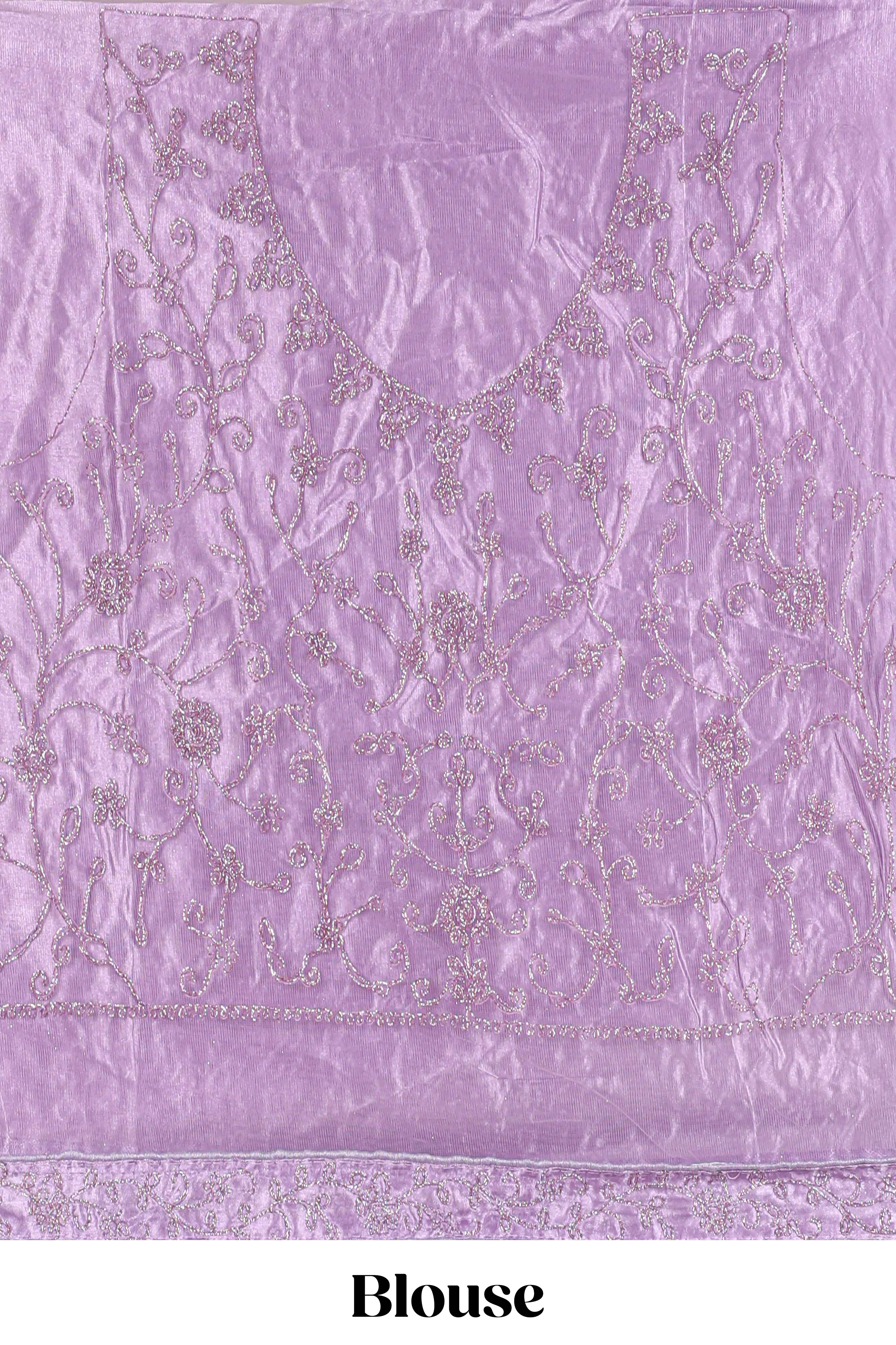 Lavender net lehenga featuring delicate embroidery with a borderless design paired with a matching self shawl
