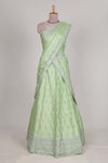 Powder green satin lehenga featuring delicate embroidery with a bordered design paired with a matching self shawl