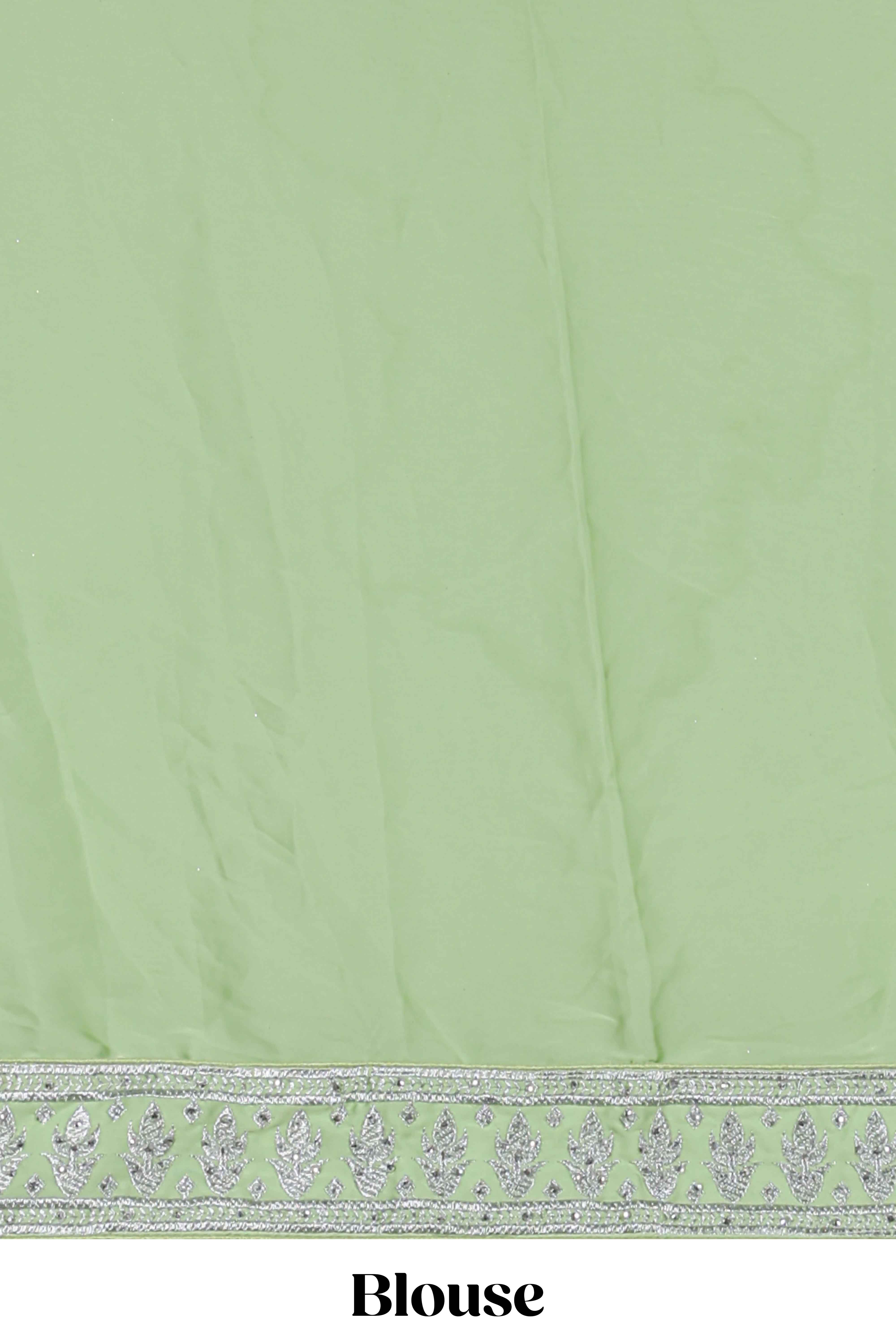 Powder green satin lehenga featuring delicate embroidery with a bordered design paired with a matching self shawl
