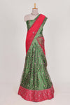 Green and red Beautiful net lehenga with intricate embroidery stone work and contrast border paired with a contrast net shawl