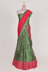 Green and red Beautiful net lehenga with intricate embroidery stone work and contrast border paired with a contrast net shawl