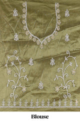 Olive Green net lehenga featuring delicate embroidery with a borderless design paired with a matching self shawl
