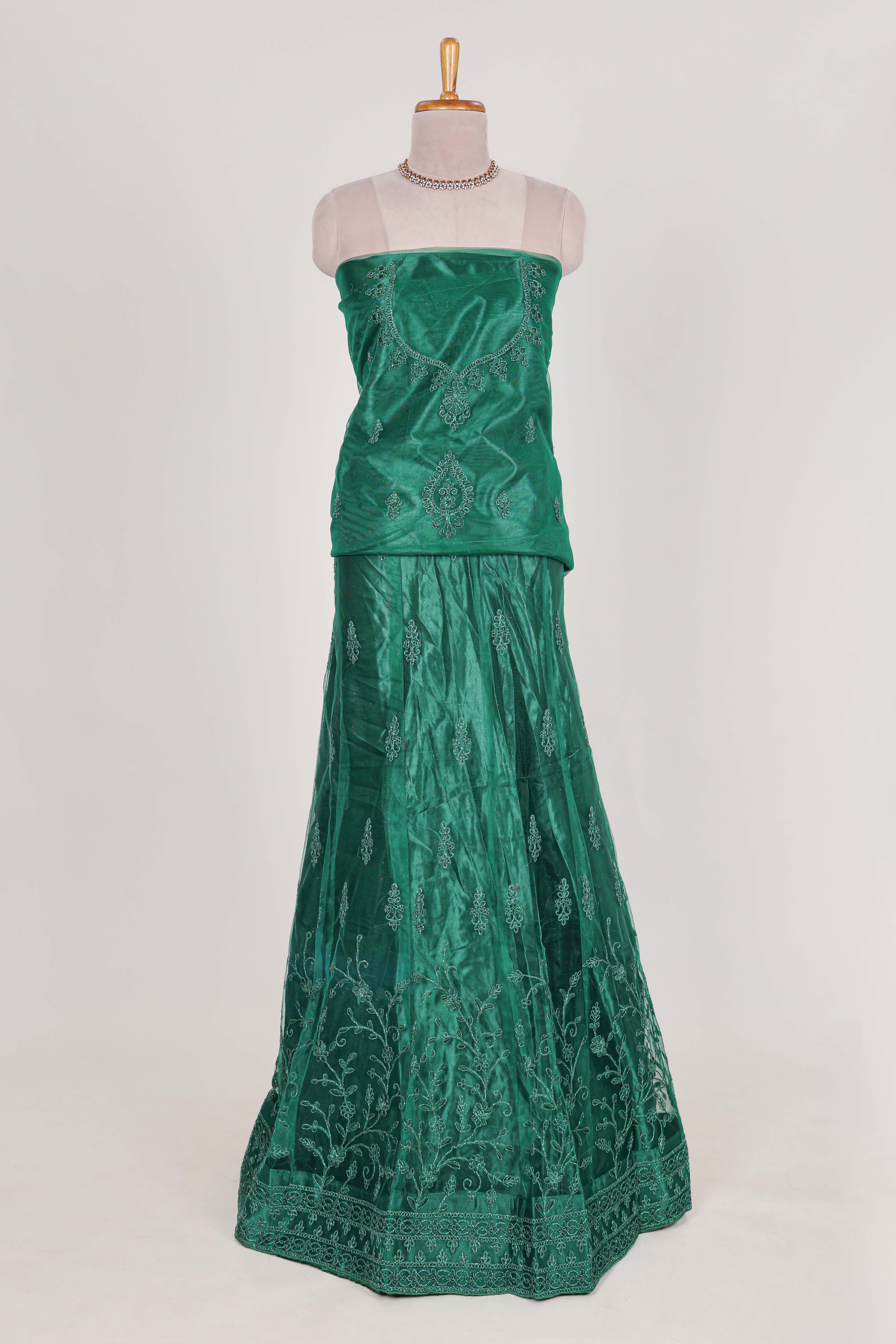Bottle Green net lehenga featuring delicate embroidery with a borderless design paired with a matching self shawl