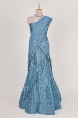 Blue colour net lehenga featuring delicate embroidery with a borderless design paired with a matching self shawl