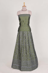 green satin lehenga featuring delicate embroidery with a bordered design paired with contrast shawl