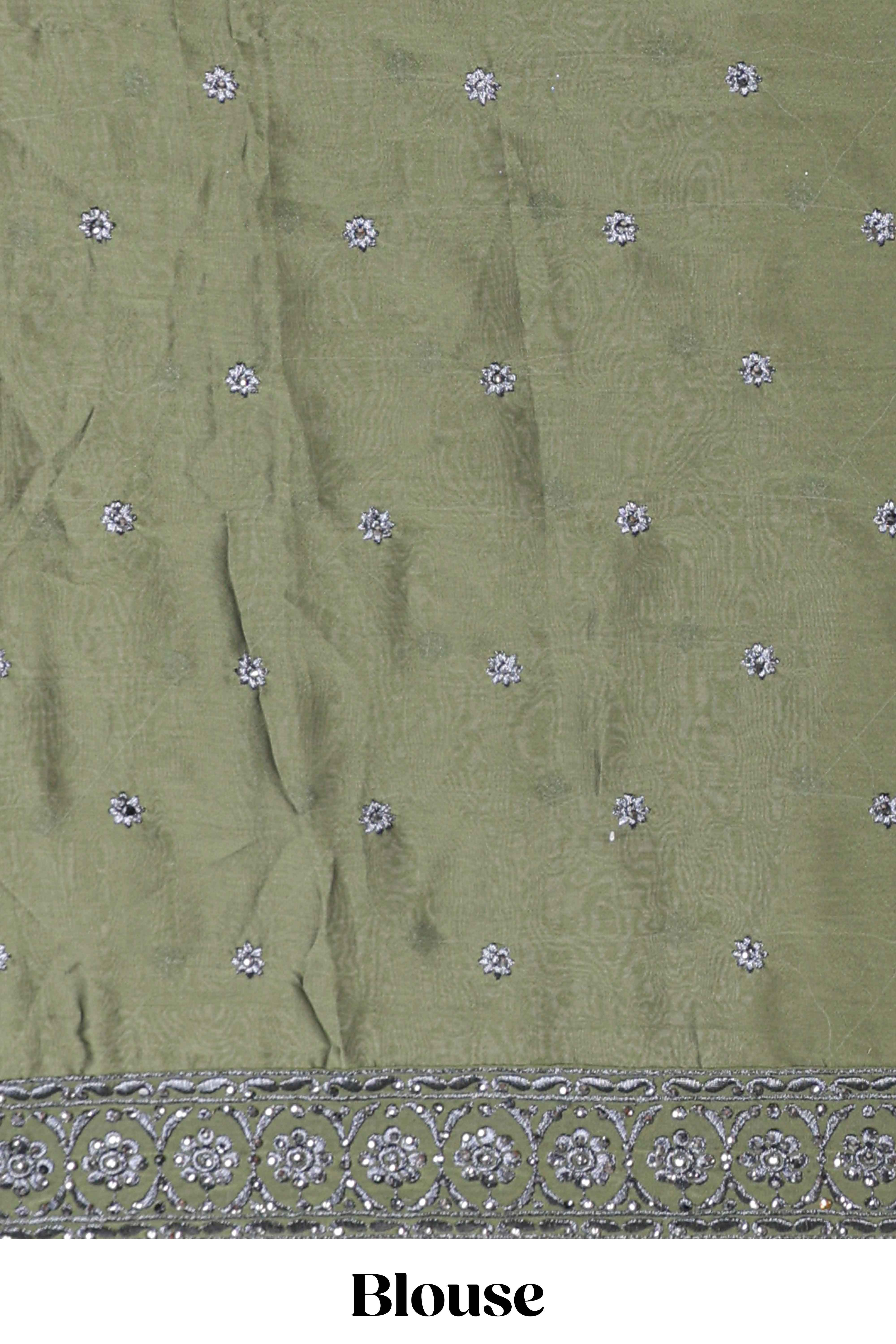 green satin lehenga featuring delicate embroidery with a bordered design paired with contrast shawl
