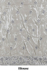 Silver satin lehenga featuring delicate embroidery with a bordered design paired with contrast shawl