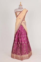 Beautiful satinlehenga adorned with intricate embroidery Paired with a contrast chiffon shawl
